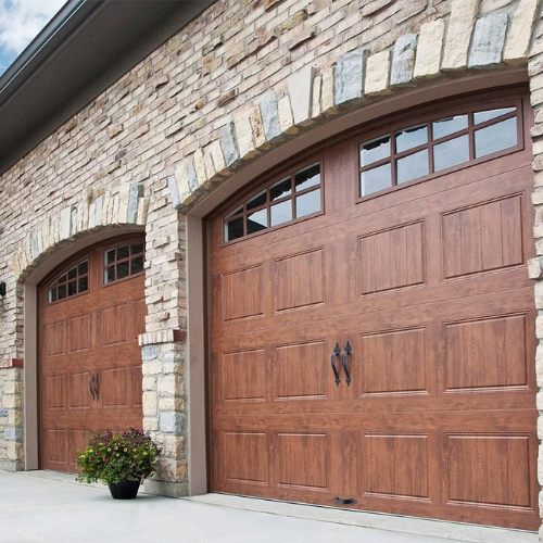 2 regular sized garage door that look wooden