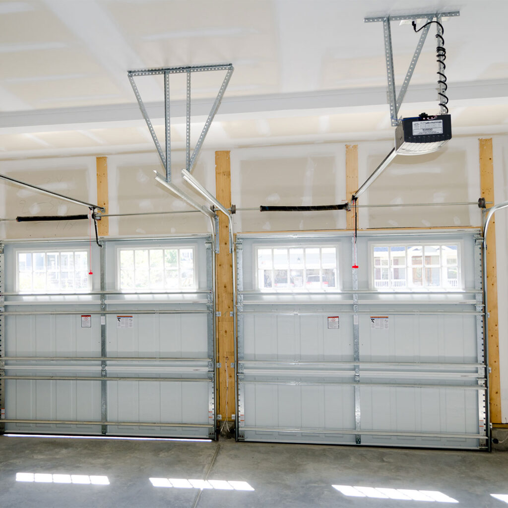 2 regular sized garage doors, inside of the garage perspective