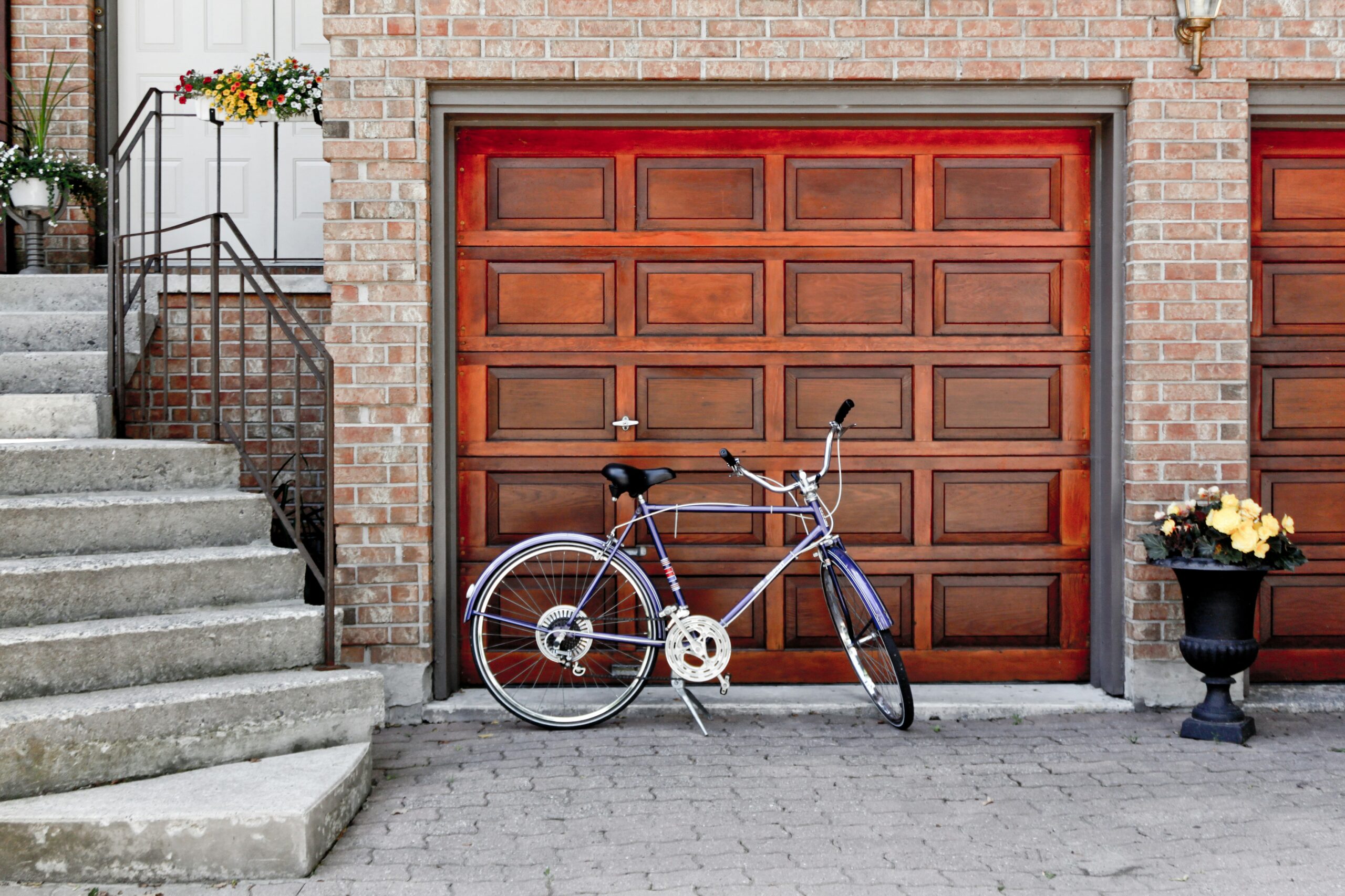 Garage Door Services Houston TX a brick garage wall with 2 small wood garage doors