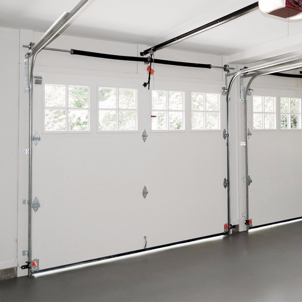 2 regular sized garage doors with torsions springs